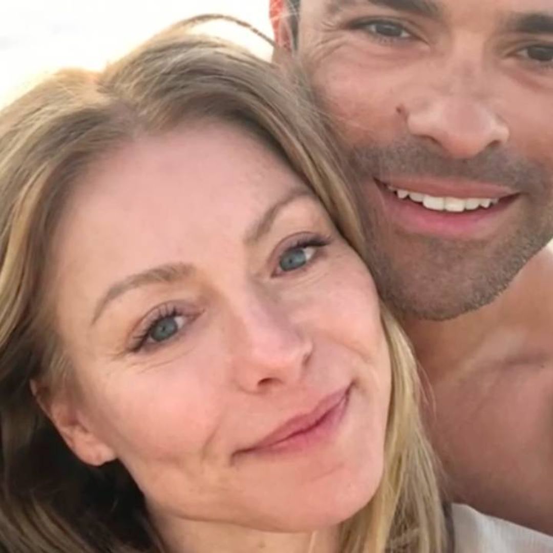 Kelly Ripa & Mark Consuelos pose on the beach in loved-up selfie
