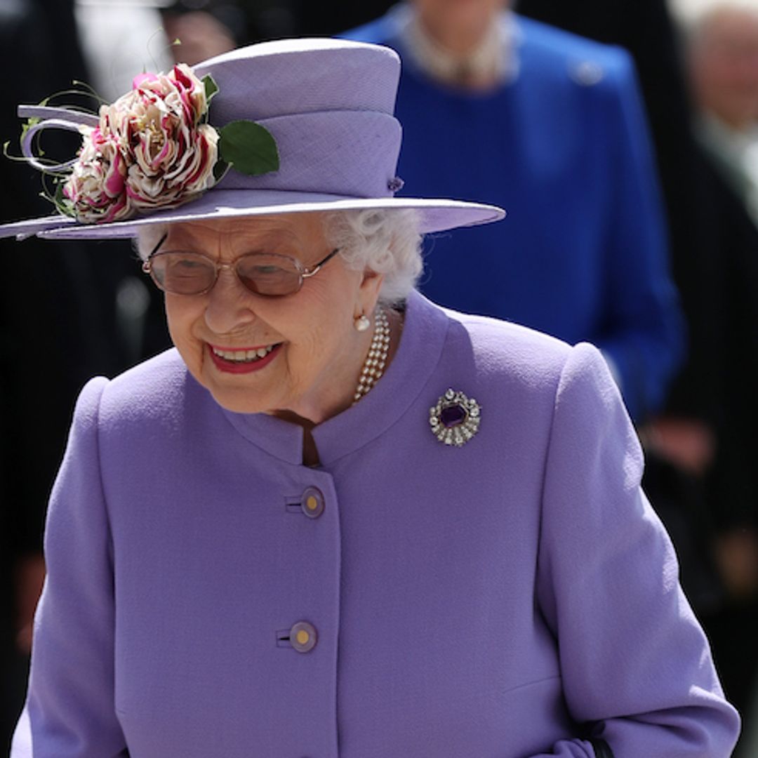 The Queen is lovely in lilac as she arrives at Epsom Races