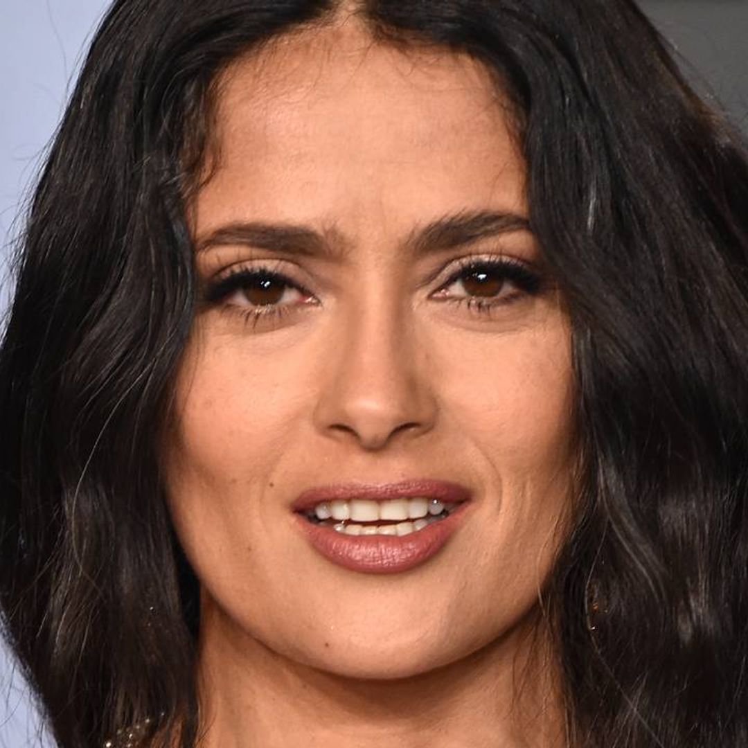 Salma Hayek looks incredible in purple swimsuit while on the beach