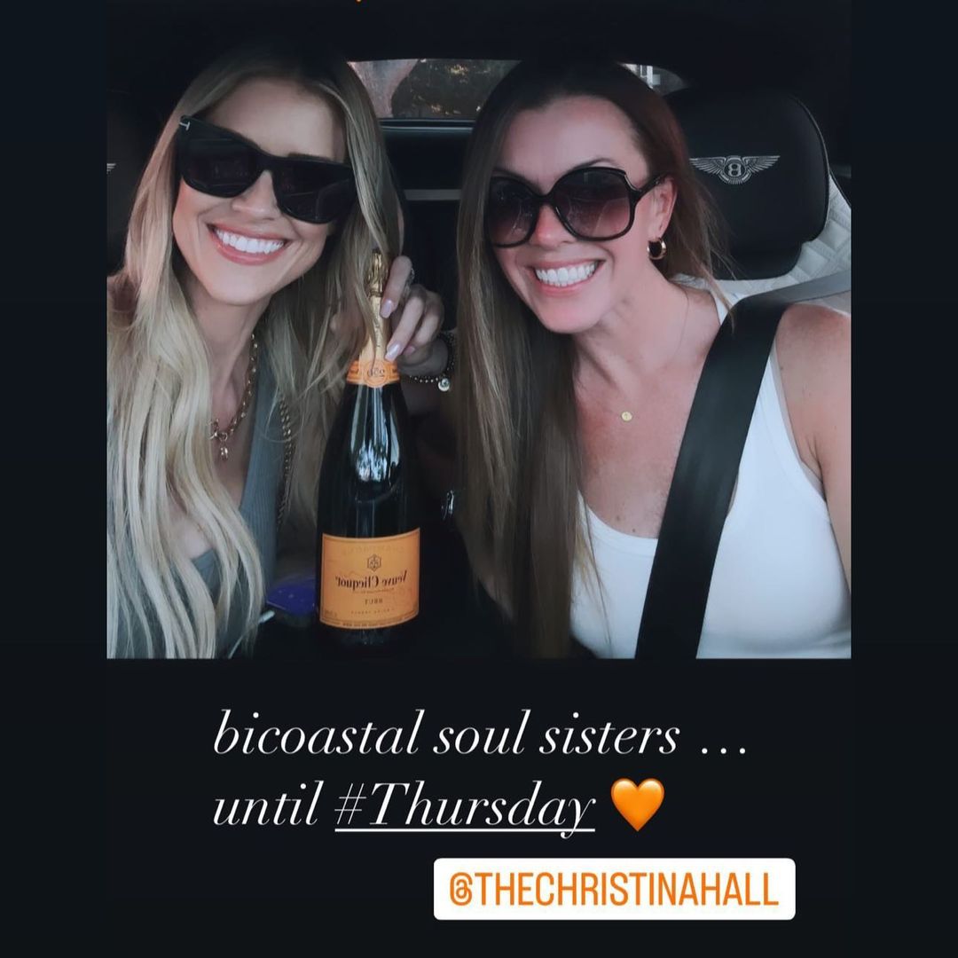 Christina smiling in her car with her friend Kristin