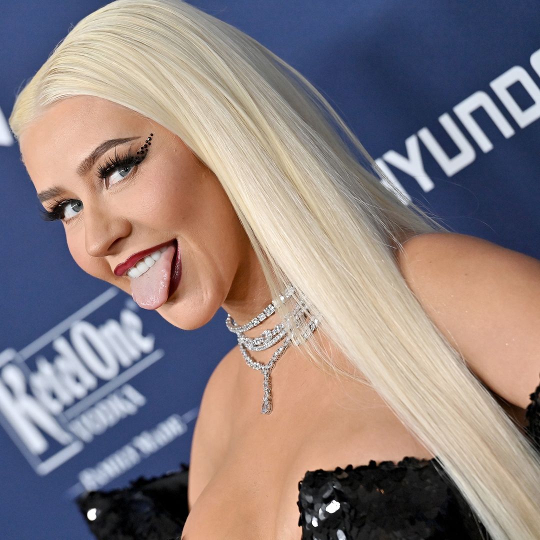 Christina Aguilera is a bombshell in skintight catsuit - see video