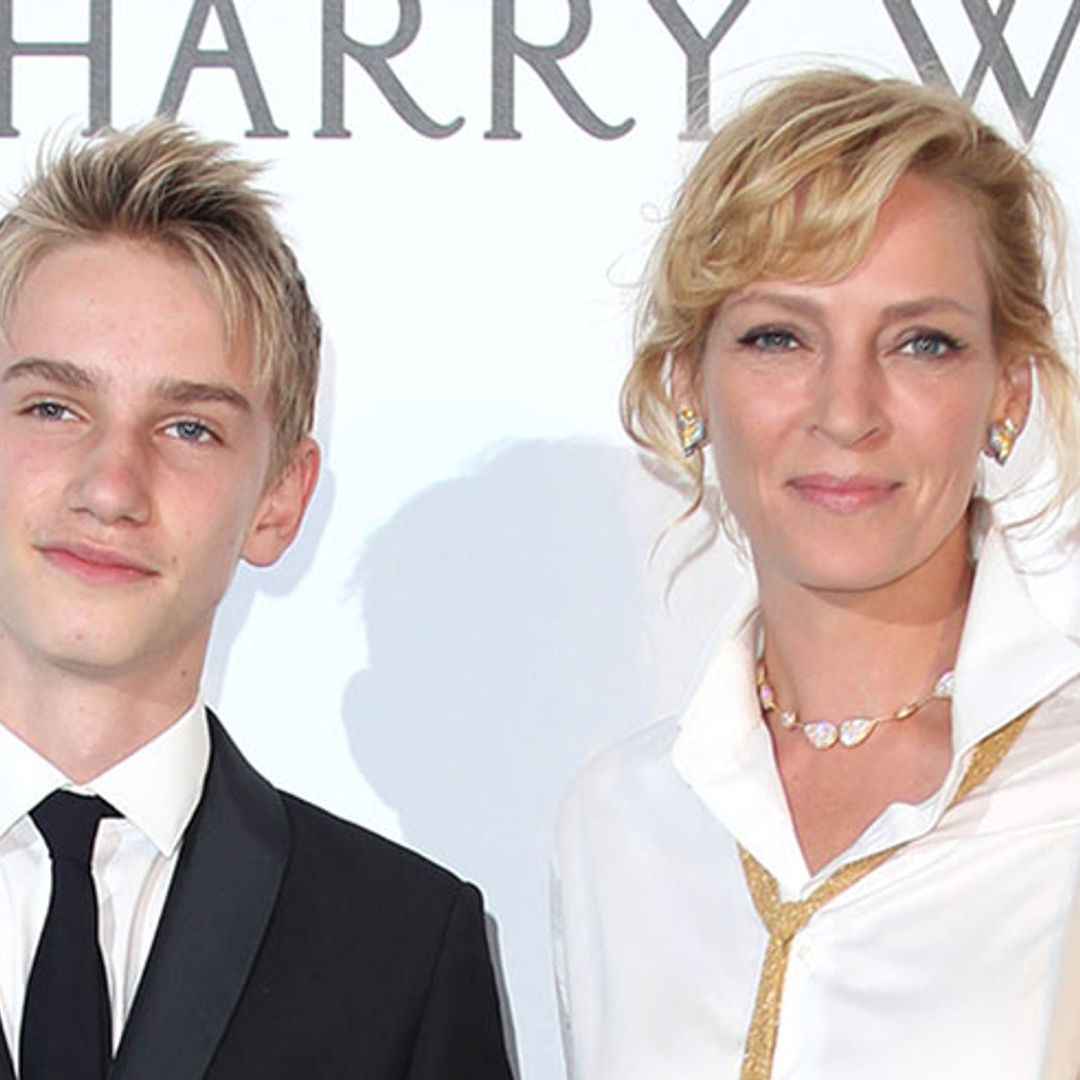 Uma Thurman turns heads in chic ensemble as she takes son Levon as her date to amfAR gala