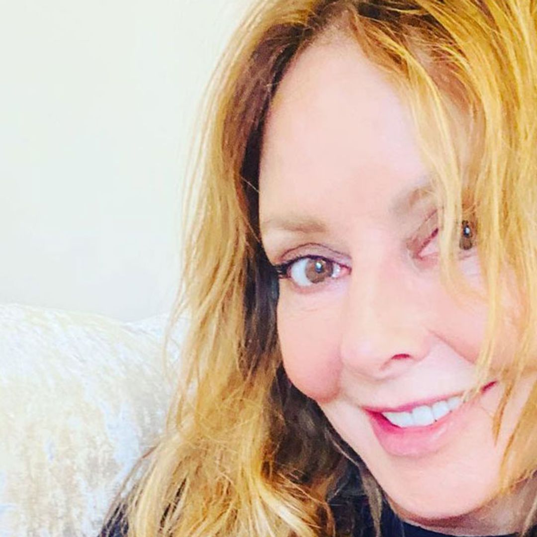 Carol Vorderman poses in figure-hugging activewear and she pleads with fans for help