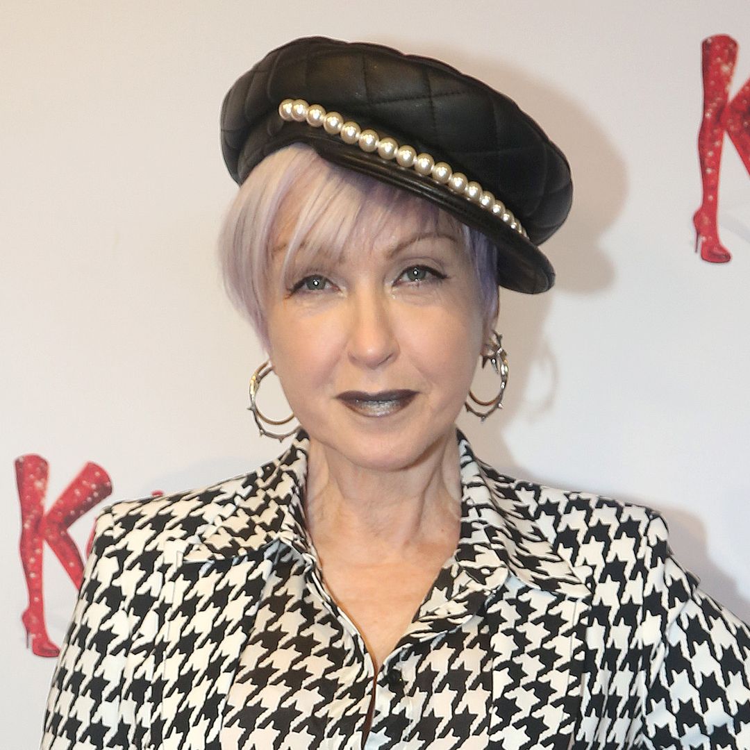 Cyndi Lauper, 72, rocks spiky blue hair and funky polka-dot suit at NYFW event with Martha Stewart