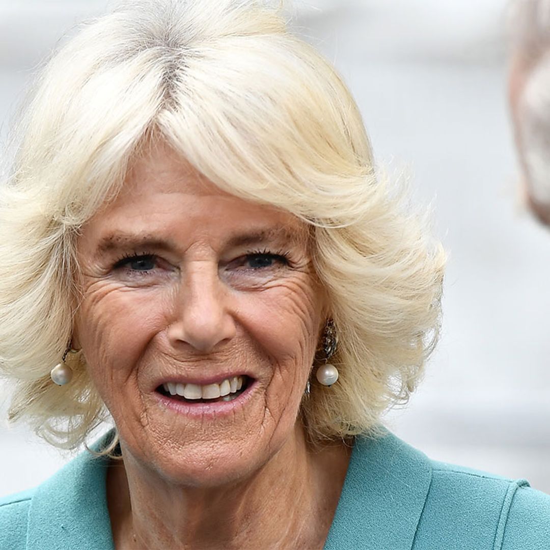 The Duchess of Cornwall dresses up her blue co-ord with some funky leather touches