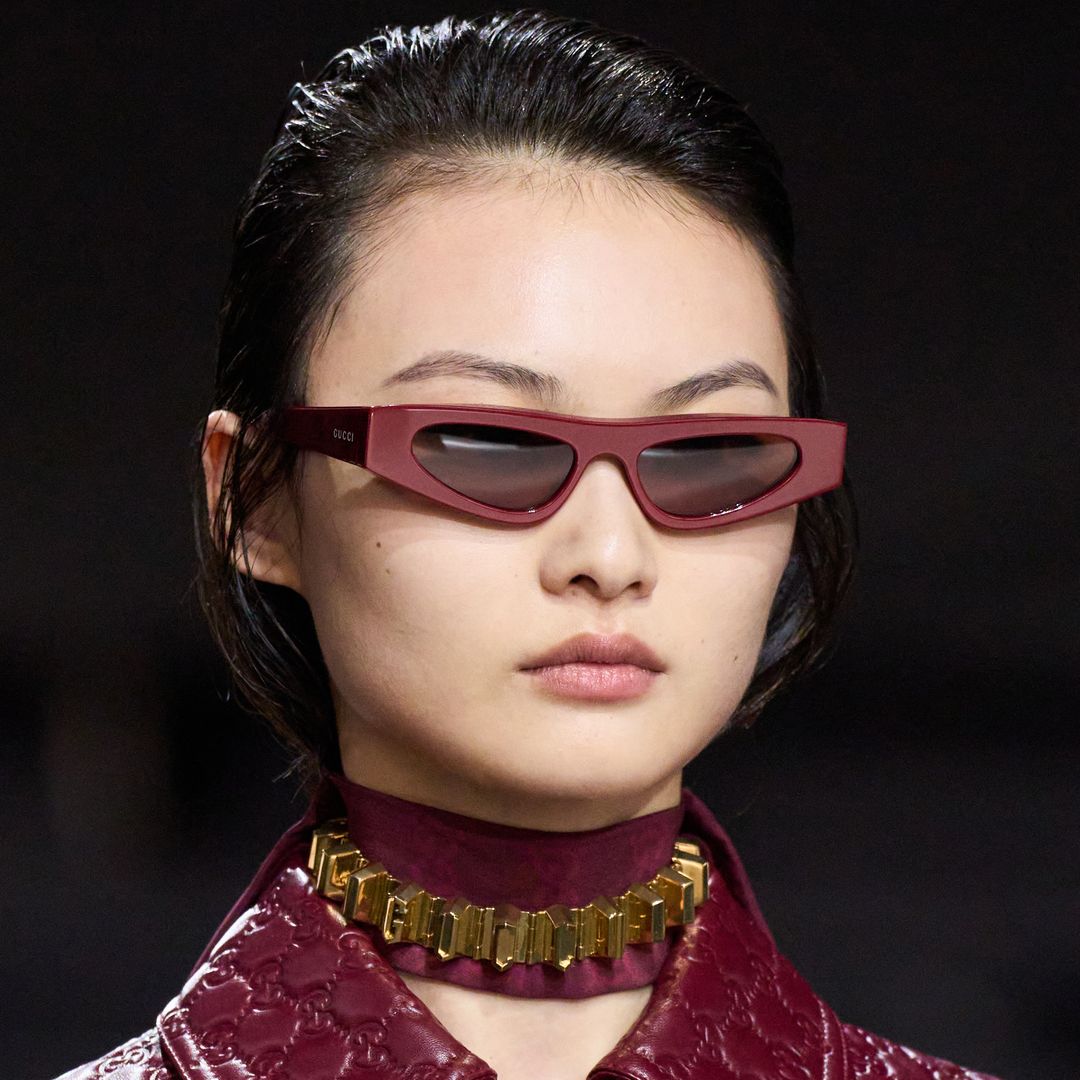 Co-ordinating sunglasses, chokers and coats at Gucci AW24