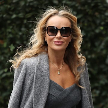 Amanda Holden stuns in knitted mini skirt and knee-high boots