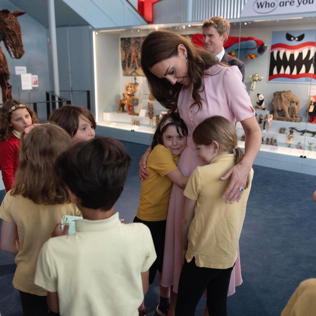 Cuddles for Princess Kate as she's given tour of revamped Young V&A museum - best photos