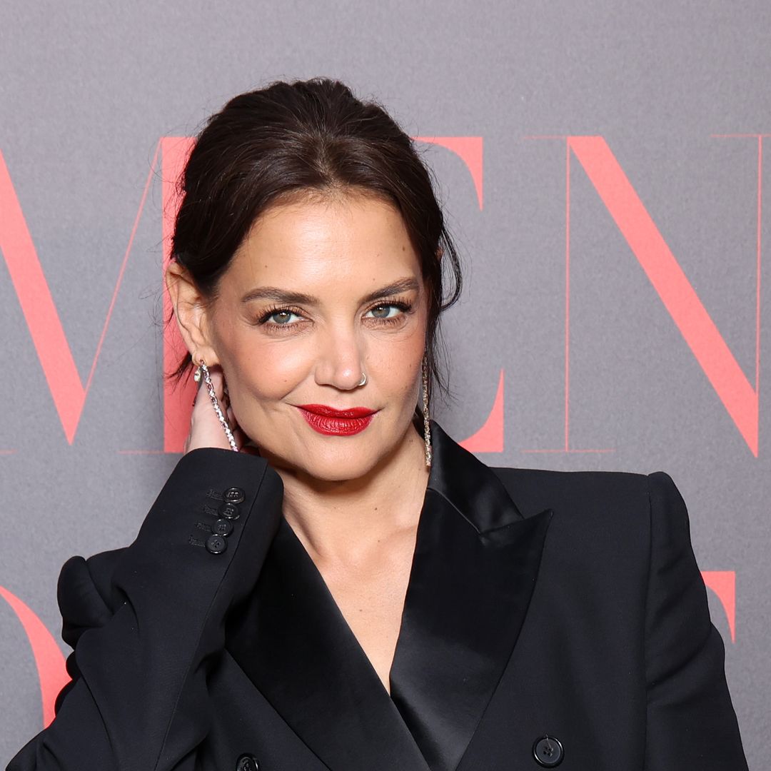 Katie Holmes accessorizes waist cinching dress with diamonds