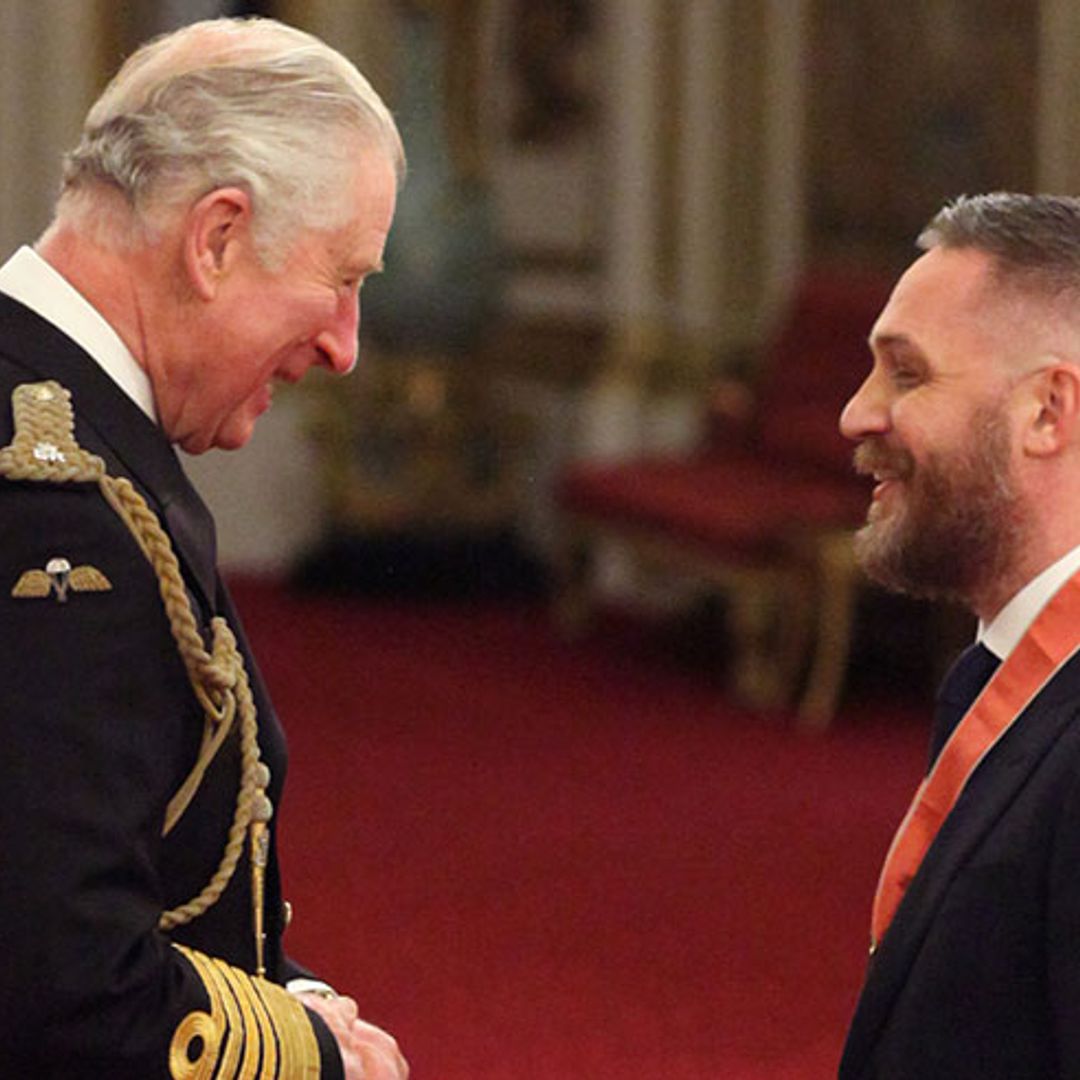 Tom Hardy laughs with Prince Charles after receiving CBE