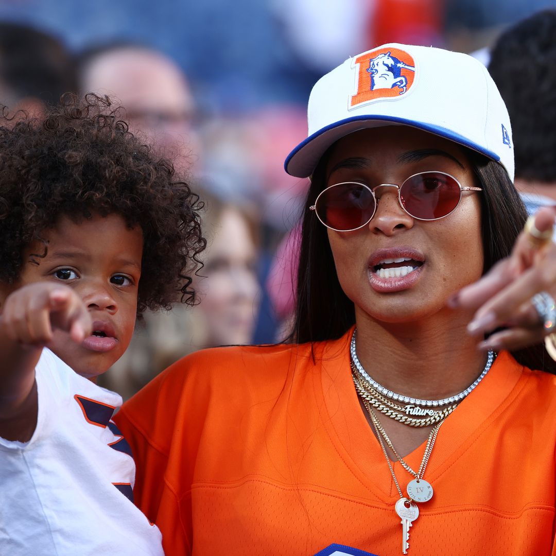Ciara and Win supporting Russell at a Denver Broncos game