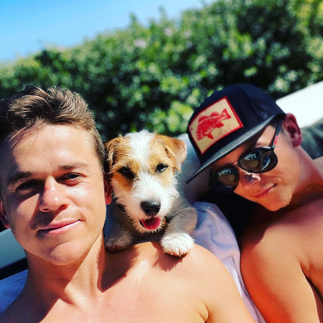 Matthew Lowe and John Owen Lowe, with their dog Daisy, relax on a boat and get a tan while shirtless in a photo shared on Instagram