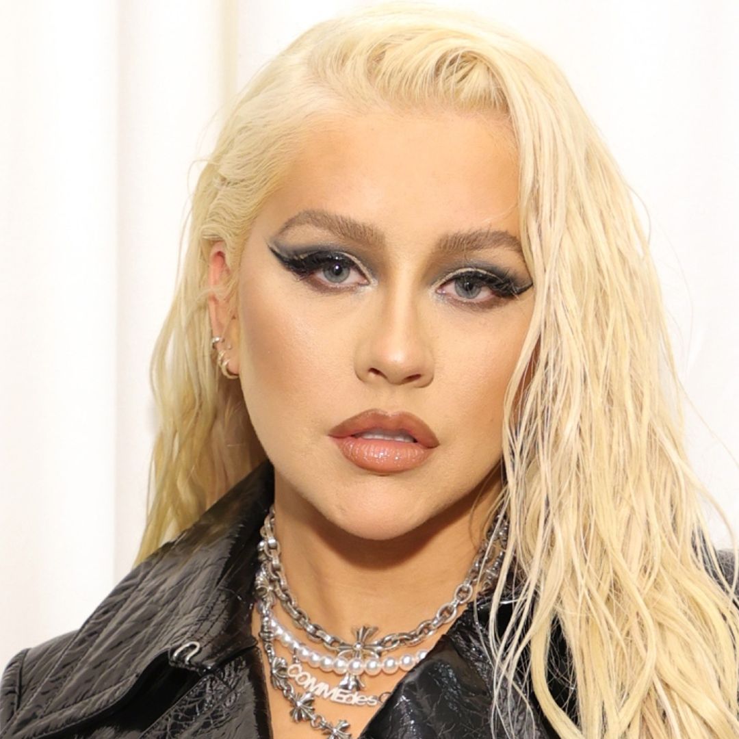 Christina Aguilera teases new release in red-hot outfit