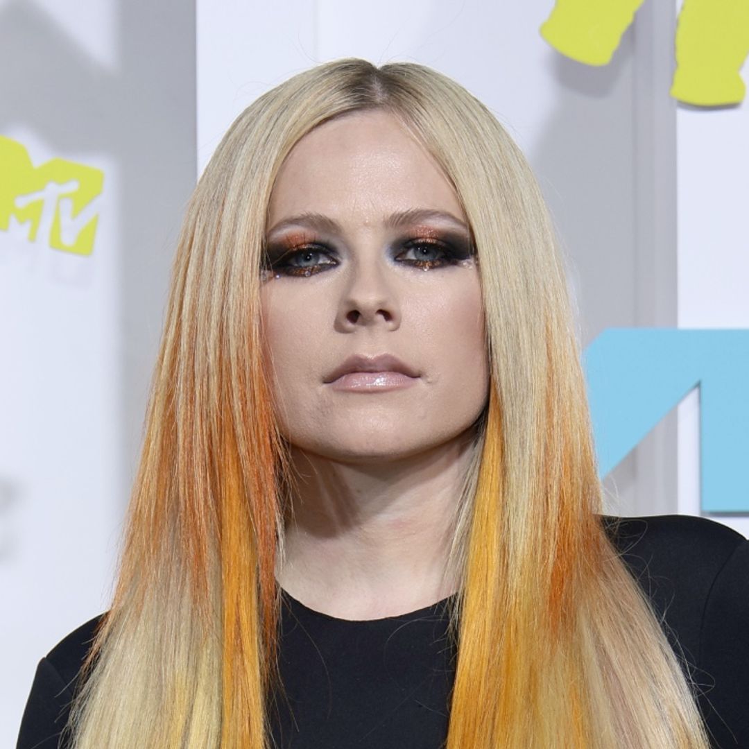 Avril Lavigne sends temperatures soaring in skin-tight see-through leather pants and bustier