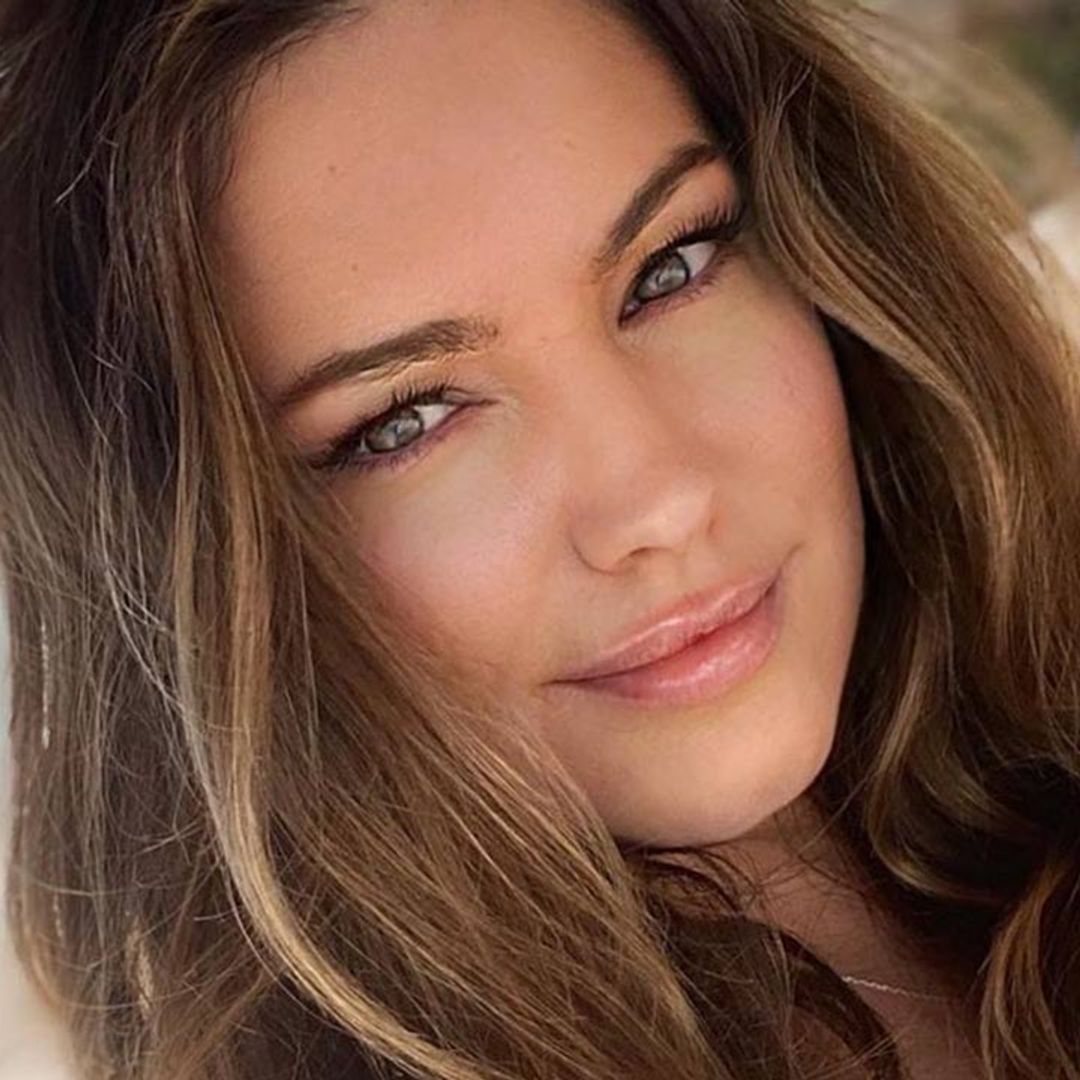 Kelly Brook wows in glamorous gold swimsuit – and we NEED her one-piece