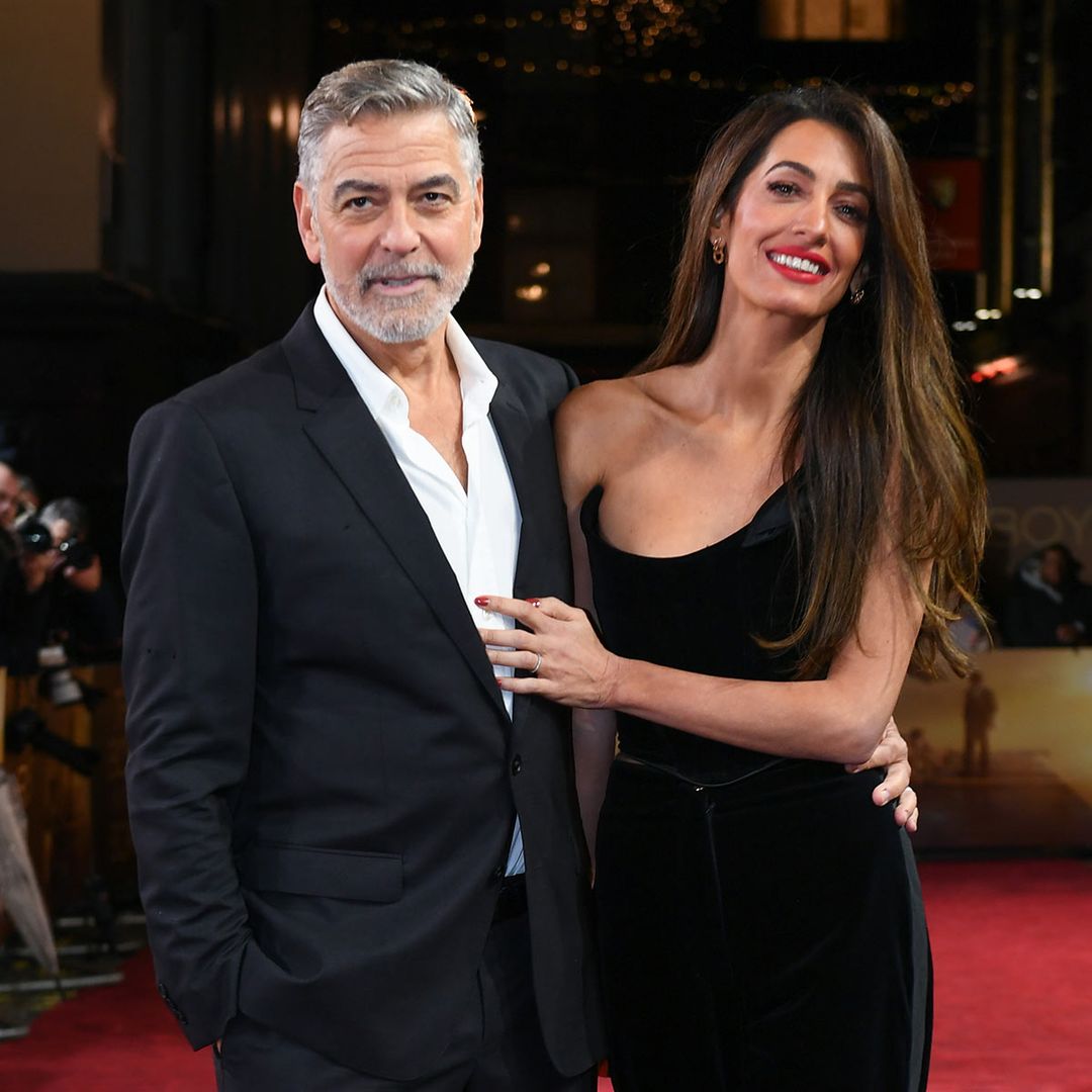 Amal Clooney turns heads in figure-hugging crop top during loved-up appearance with George Clooney