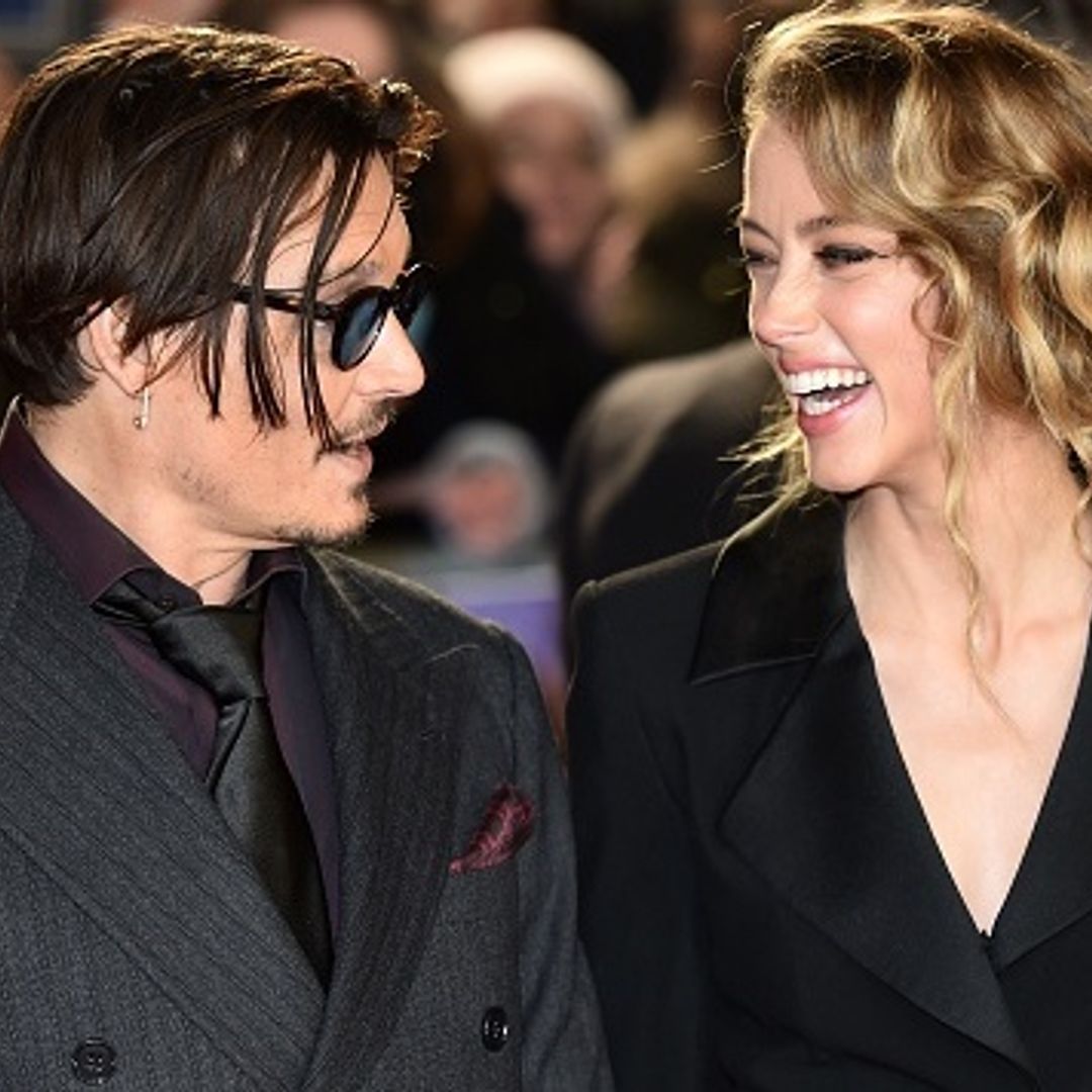 Johnny Depp packs on the PDA with Amber Heard at charity event