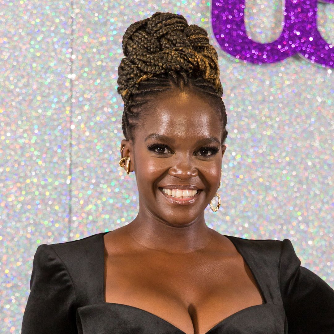 Oti Mabuse is an actual goddess in deep-V power suit and stilettos