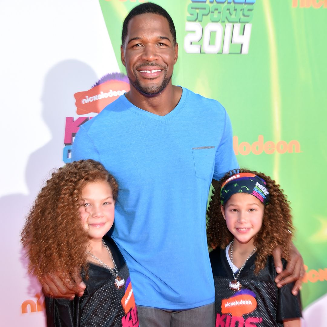 Host Michael Strahan (C) with daughters Sophia Strahan and Isabella Strahan attend Nickelodeon Kids' Choice Sports Awards 2014 at UCLA's Pauley Pavilion on July 17, 2014 in Los Angeles, California.