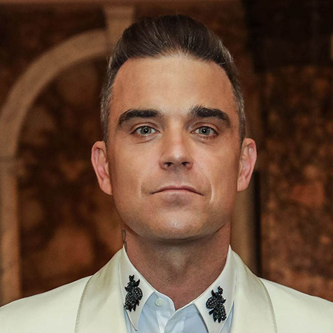Robbie Williams reveals younger new look - see pictures