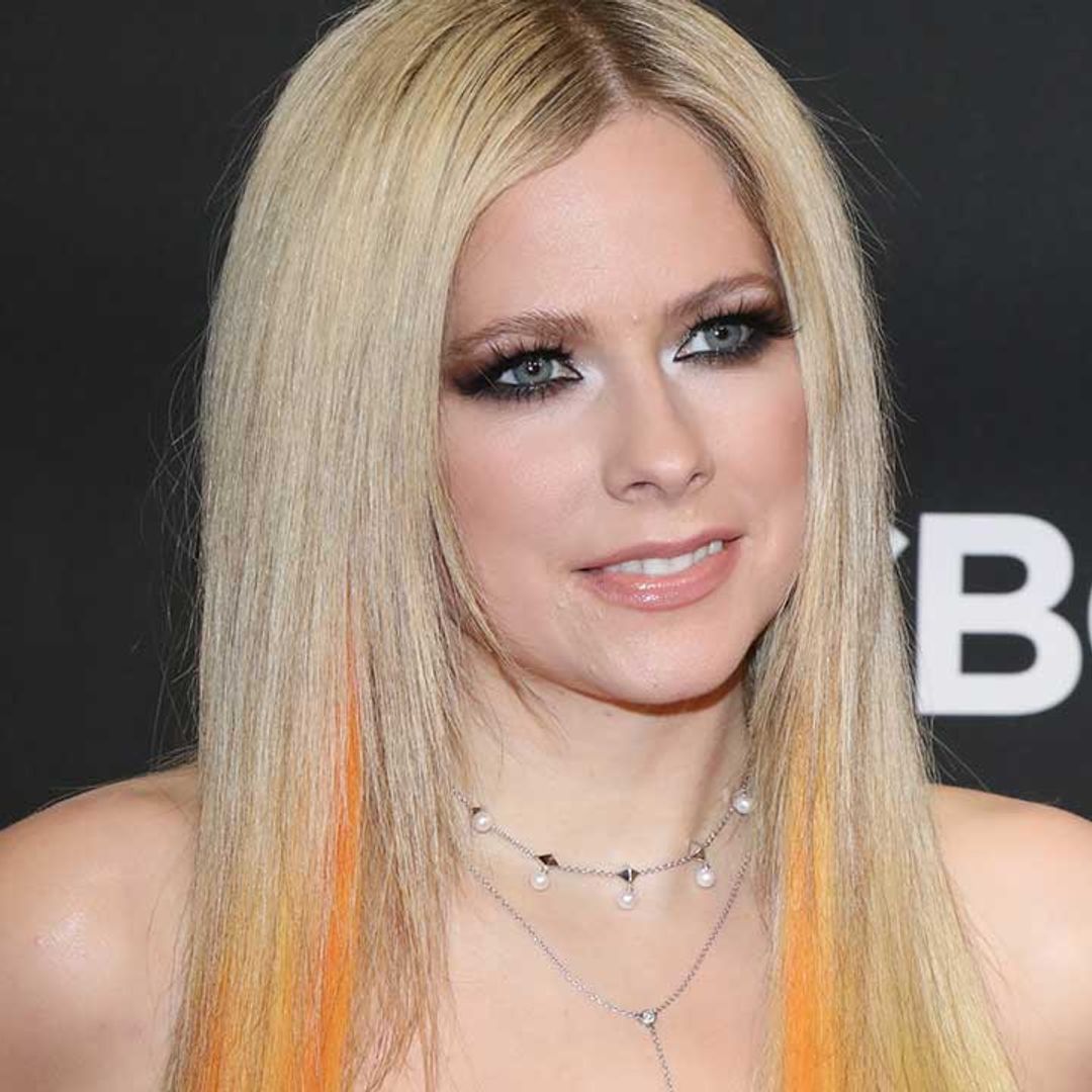 Avril Lavigne rocks satin bustier and leather for wild night out