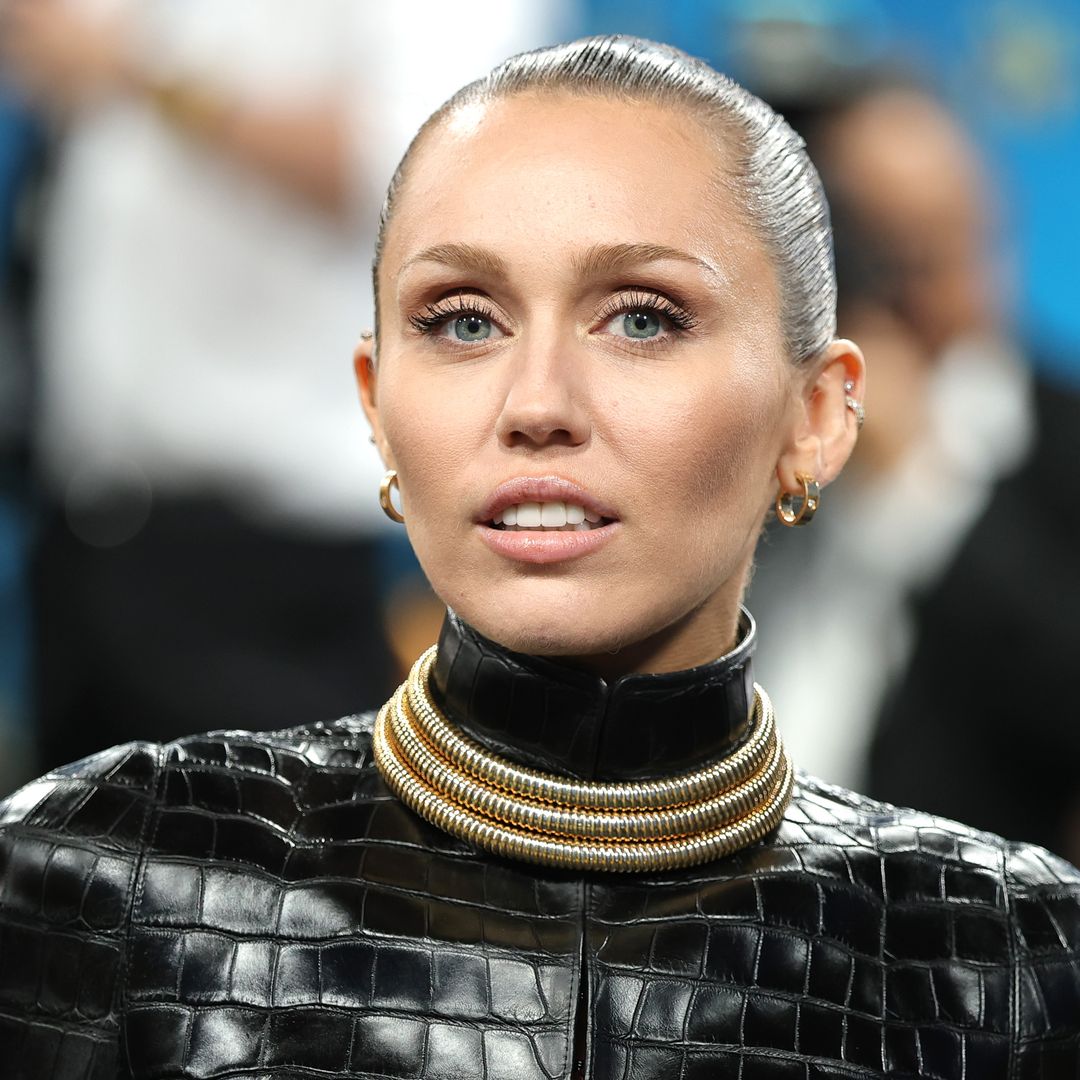 Miley Cyrus schools us on how to wear a leather mini skirt and sheer tights for date night