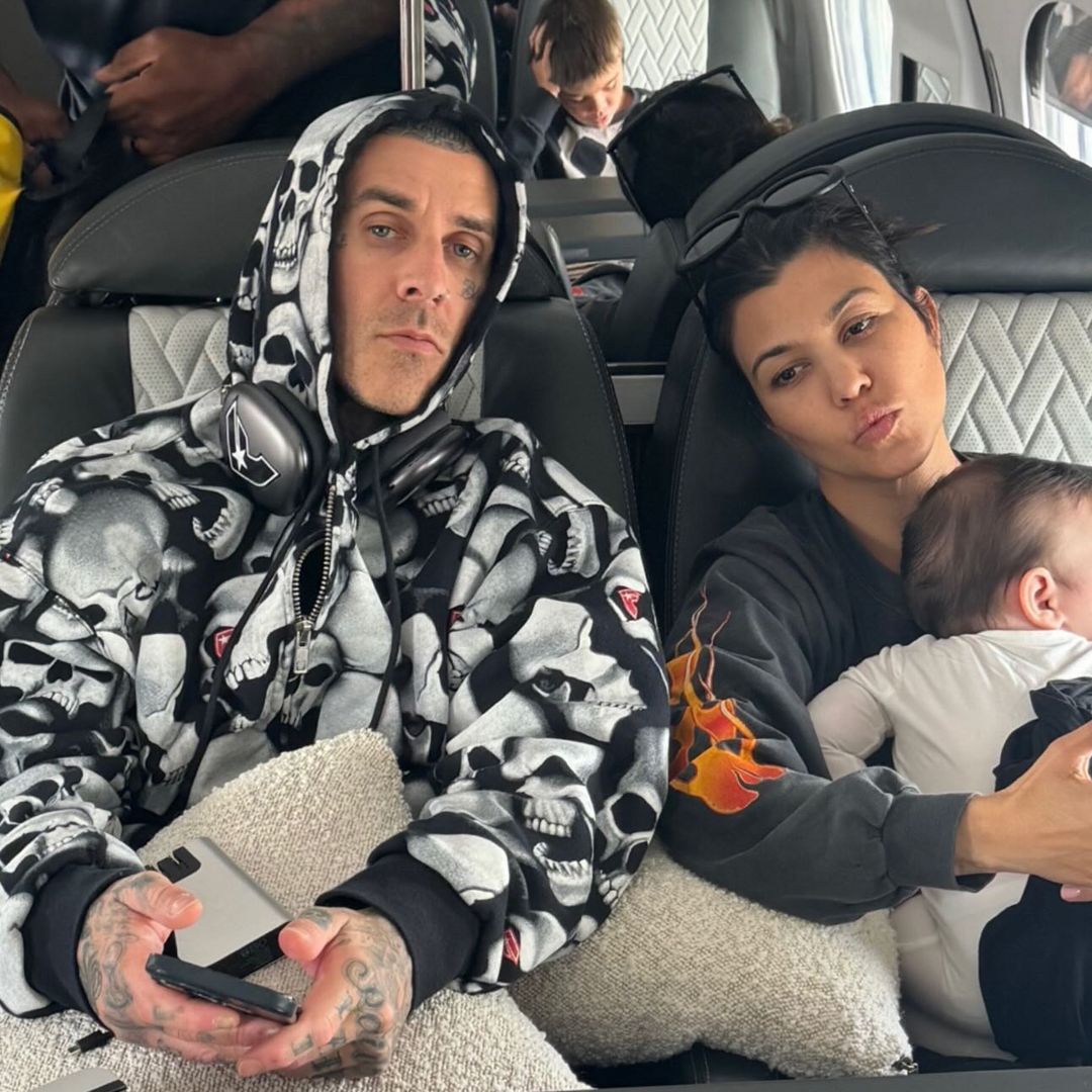 Kourtney Kardashian and baby Rocky fly across the world to support Travis Barker