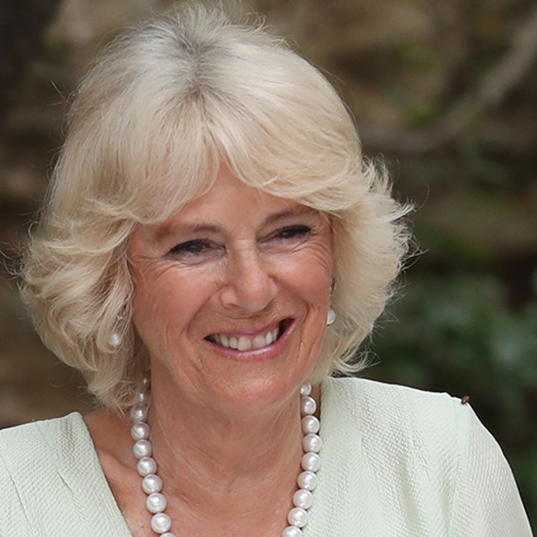 The Duchess of Cornwall wears the most regal of colours and looks amazing