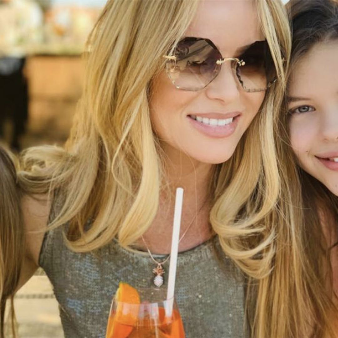Amanda Holden wears the perfect summer dress as she poses with her two daughters 