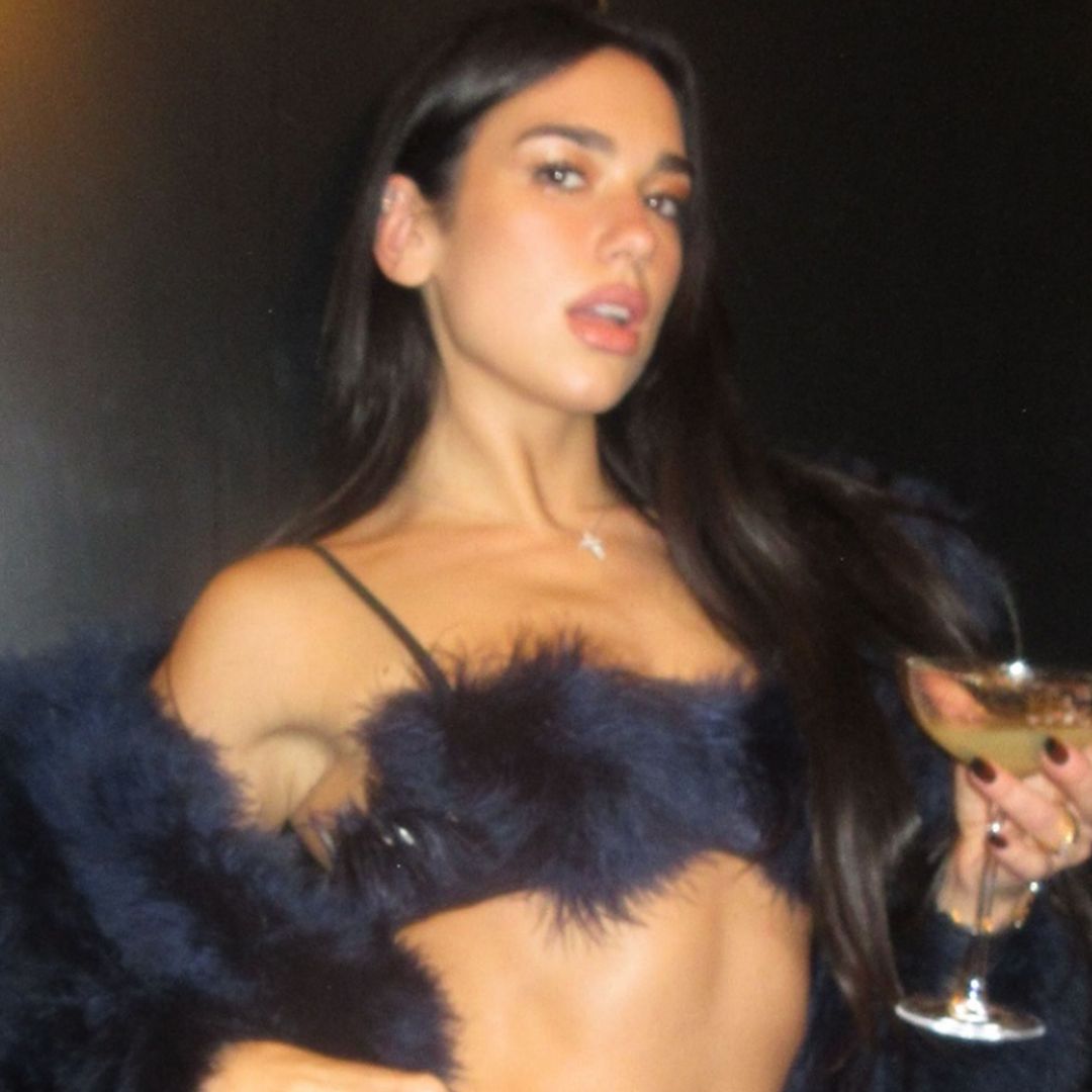 Dua Lipa kisses 'fiancé' Callum Turner and shows off dazzling 'engagement' ring in New Year's celebration snaps