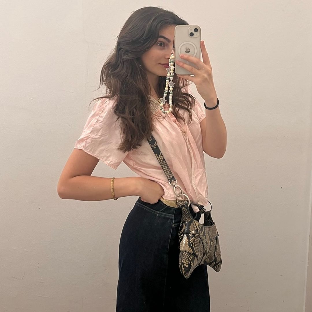 firl in a vintage pink bed jacket and thrifted denim maxi skirt