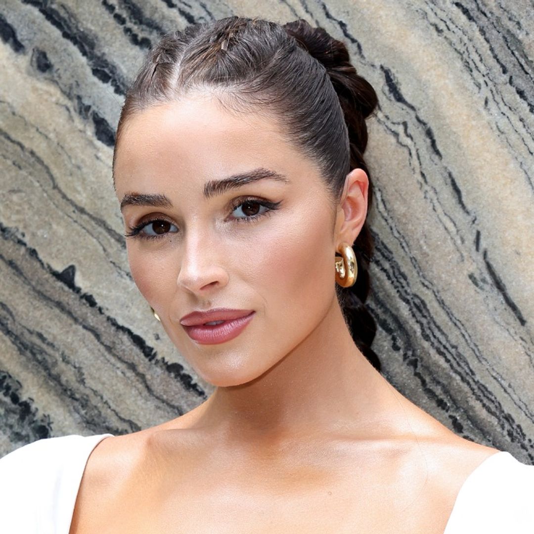 Olivia Culpo engages in hilariously leggy antics in a sheer mini dress