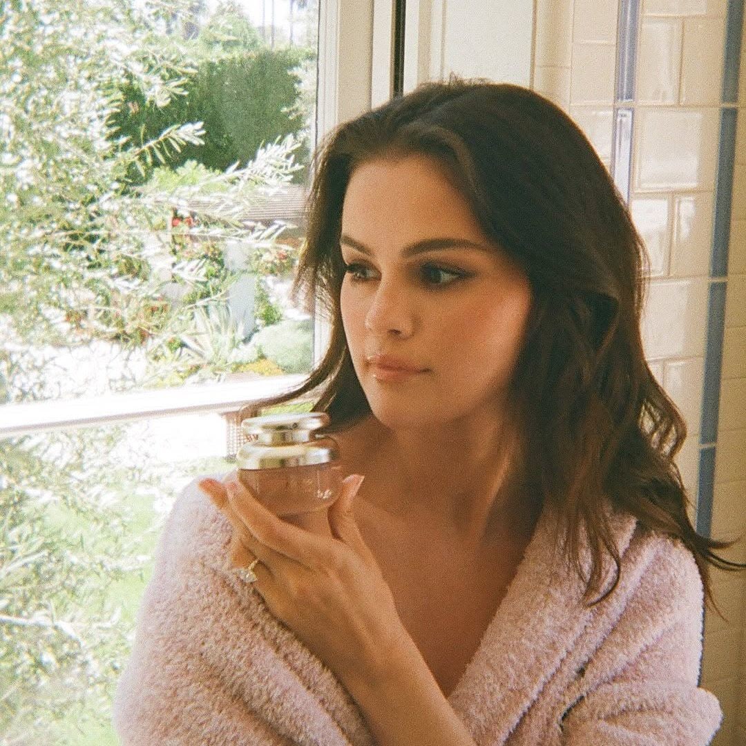 Selena gomez wearing a pink robe 