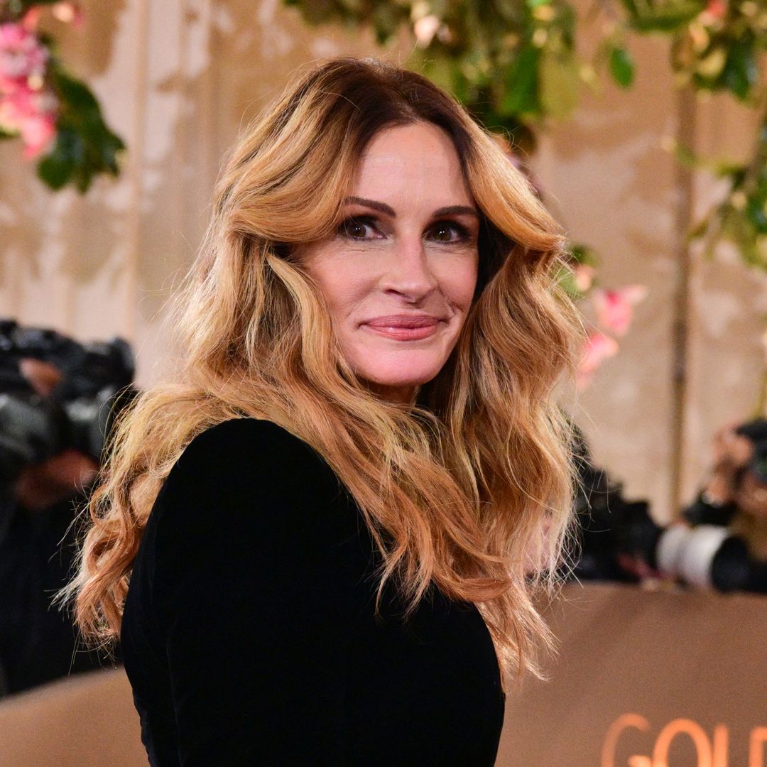 Julia Roberts looks radiant on the red carpet in plunging black gown