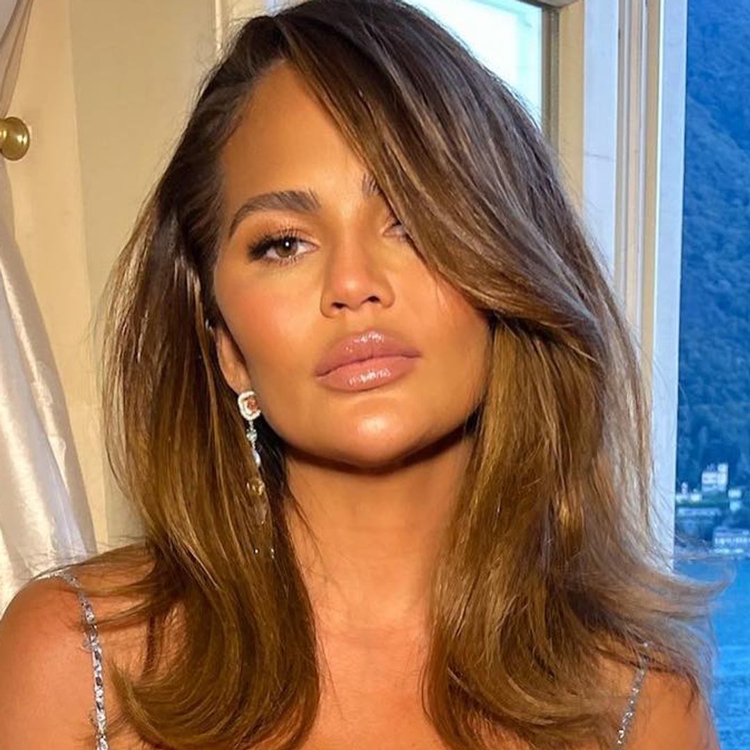 Chrissy Teigen looks beautiful in lace bralet and high-rise jeans for family photos
