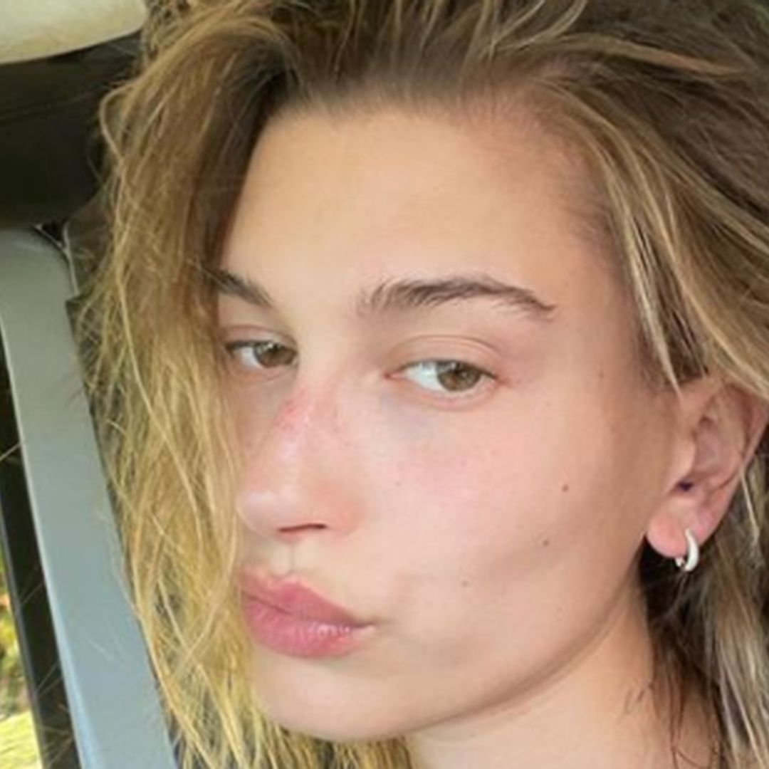 Hailey Bieber's bright pink holiday outfit will leave you with questions