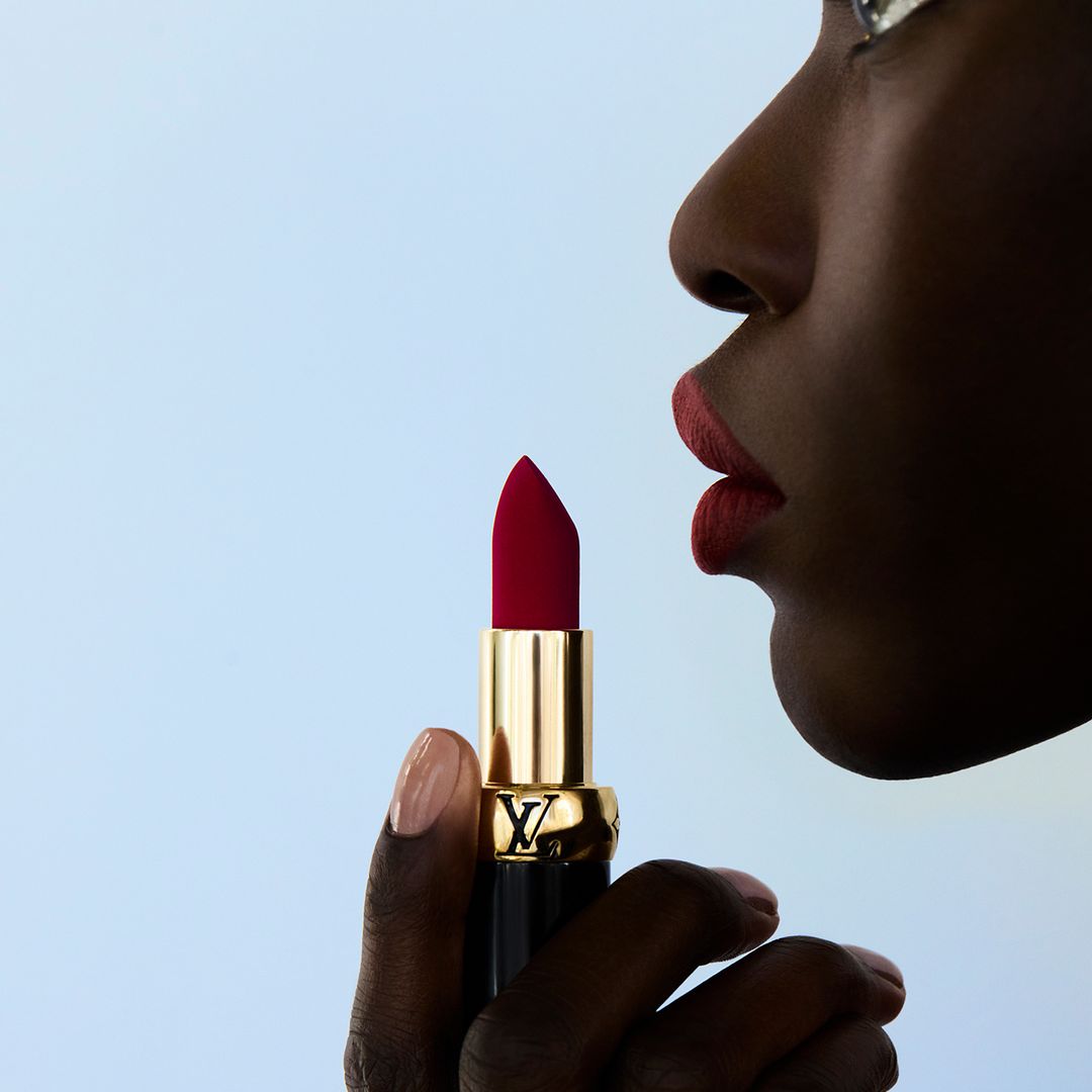 La Beauté Louis Vuitton woman putting on lipstick lipstick 