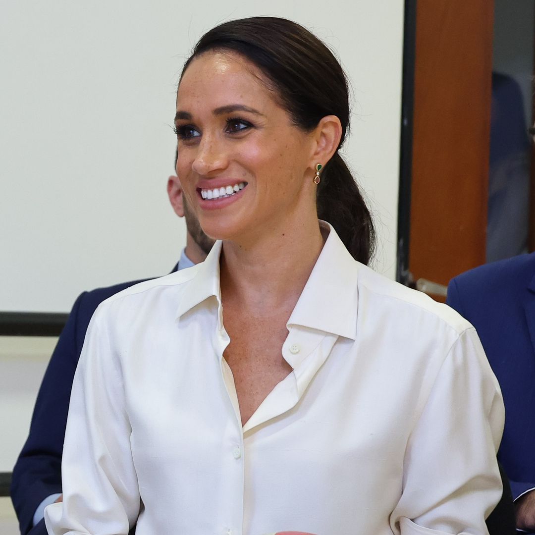 Meghan Markle amazes in silk blouse and thigh-split slinky skirt