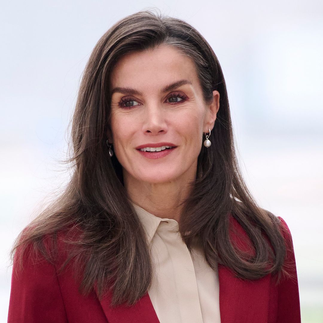 Queen Letizia oozes style in waist-cinching festive suit alongside King Felipe