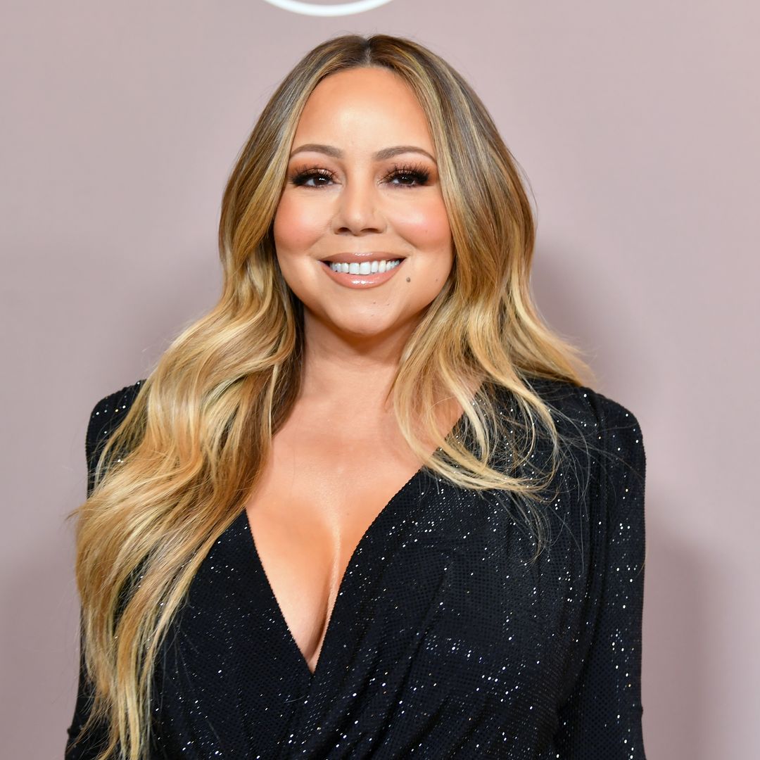 Mariah Carey looks incredible in hot pink wetsuit as she marks her birthday out at sea