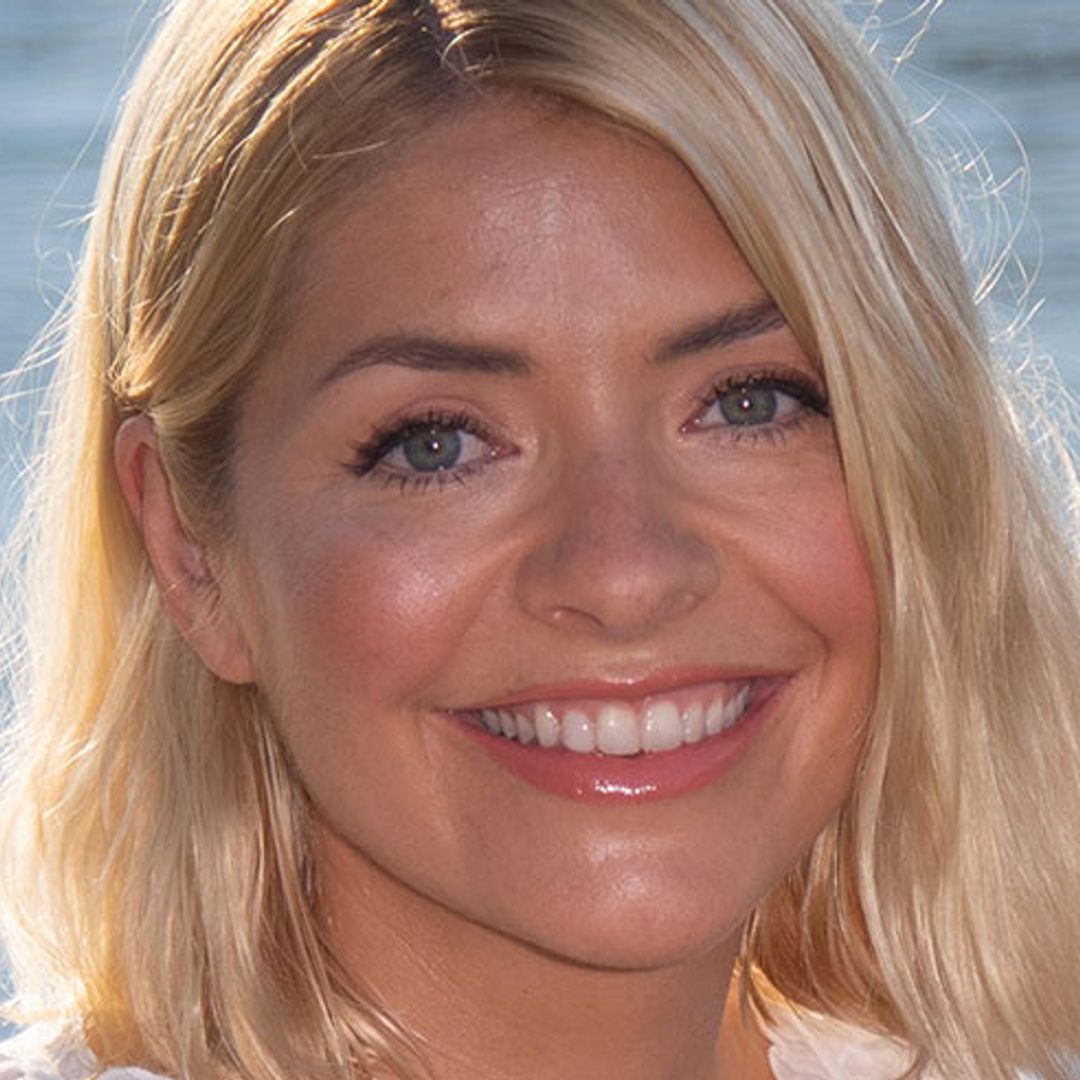 Holly Willoughby rocks Topshop boots and a leather mini skirt on I'm a Celeb