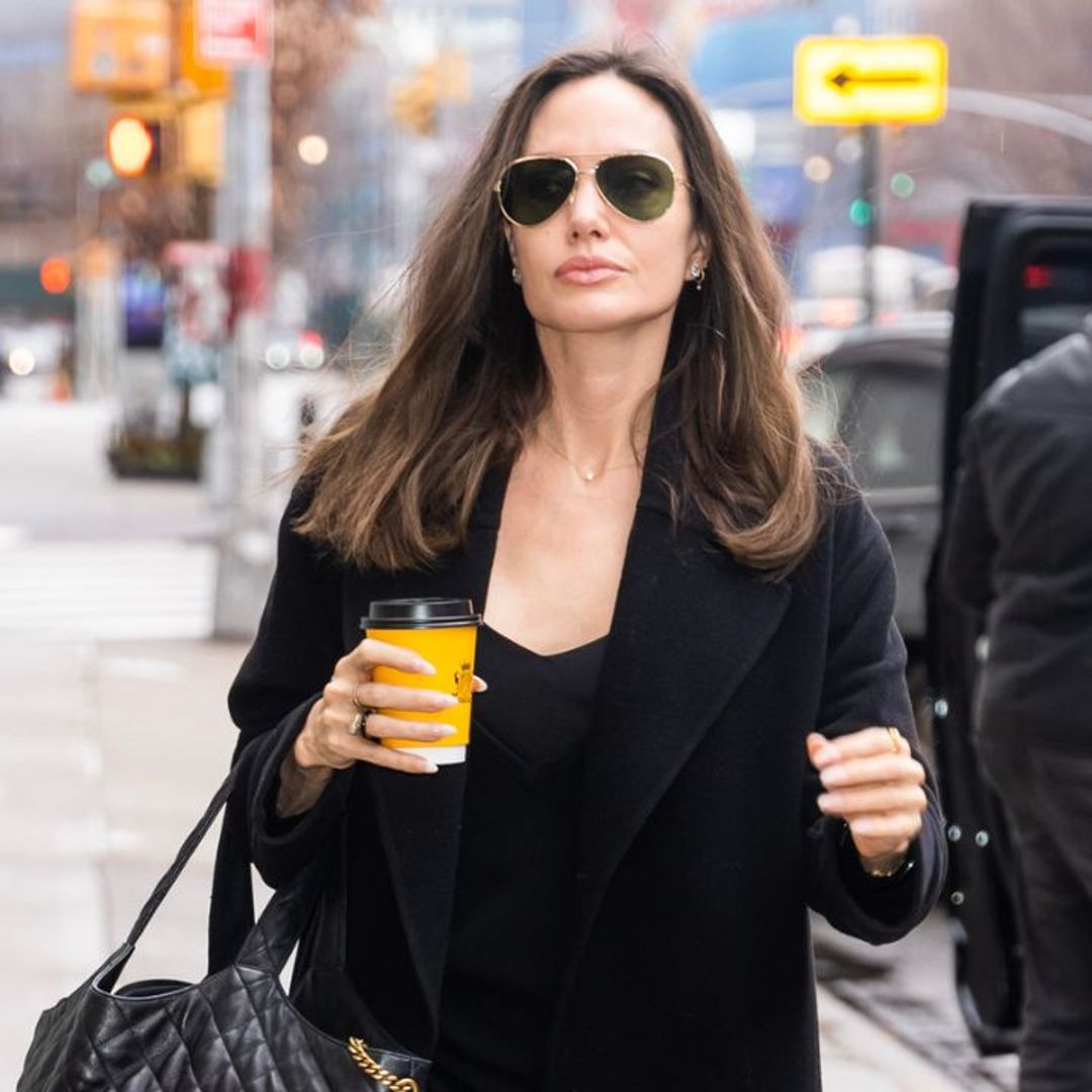 Angelina Jolie just perfected the coffee run in a 90s throwback slip dress
