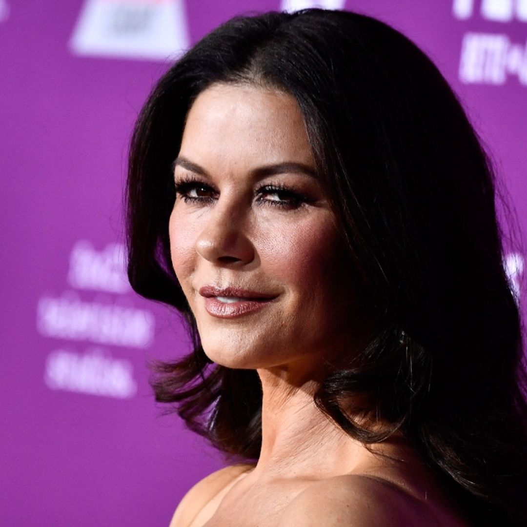 Catherine Zeta-Jones commands attention in sheer dress and tights in incredible throwback
