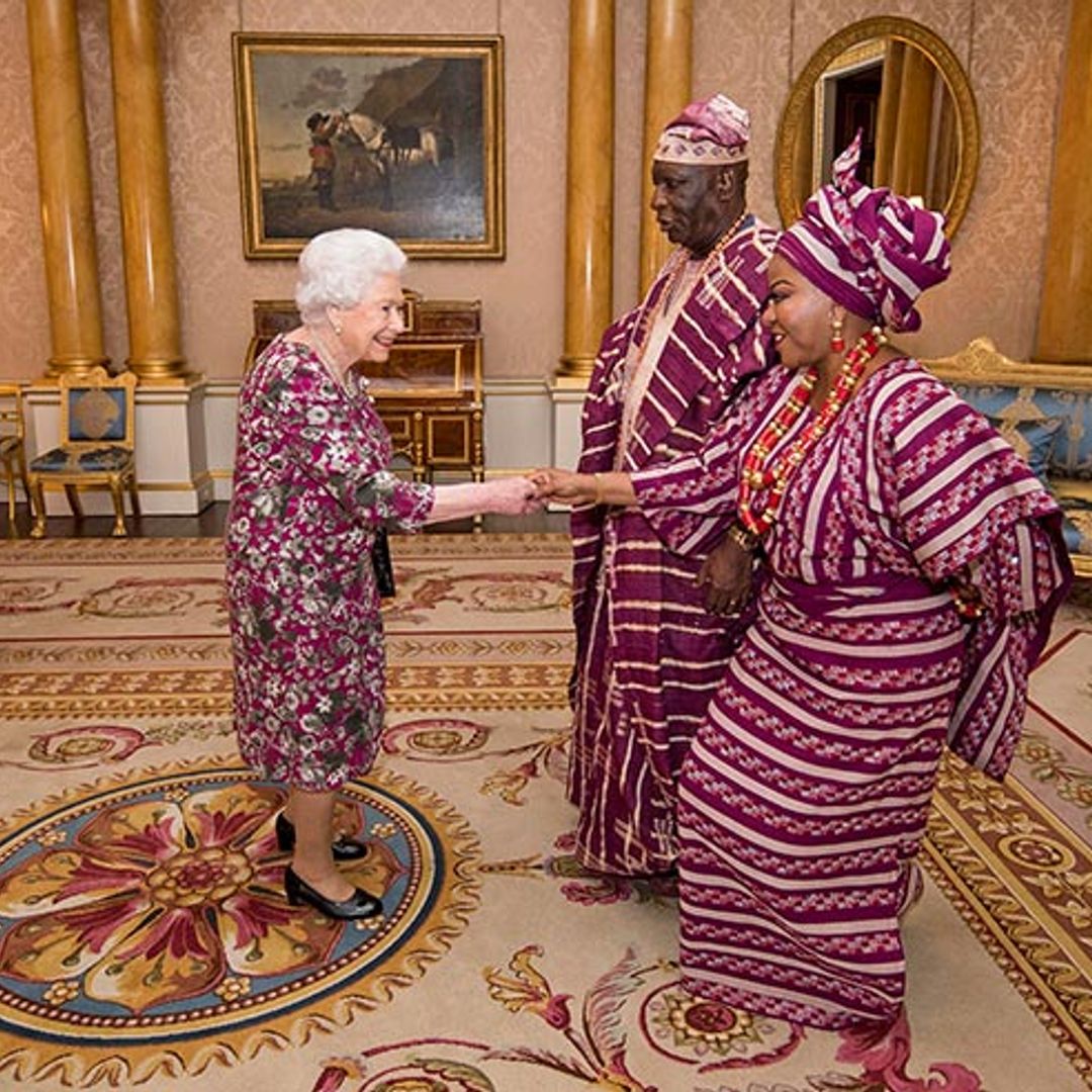The Queen is a true fashionista as she perfectly co-ordinates with guests