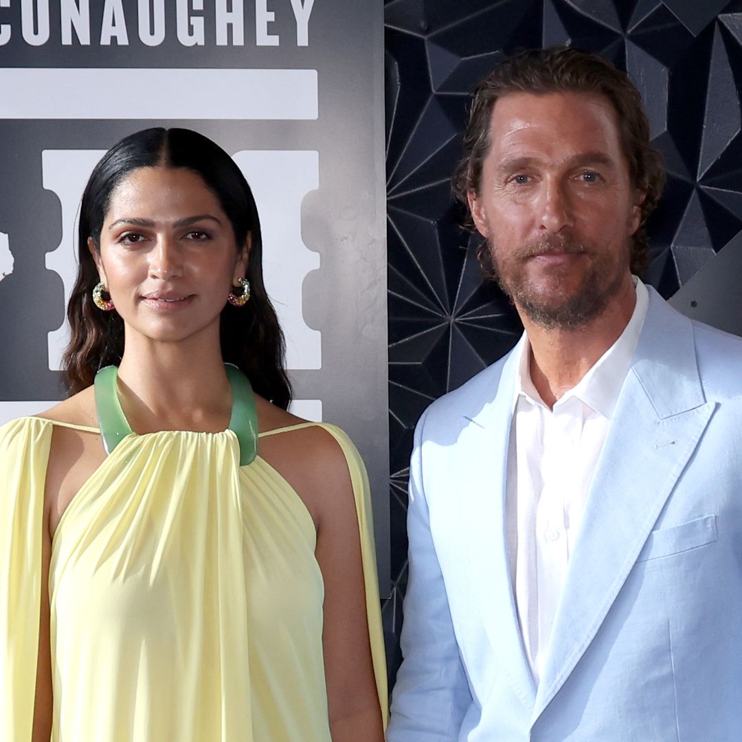 Matthew McConaughey's lookalike son, 14, almost towers over his parents in rare public outing