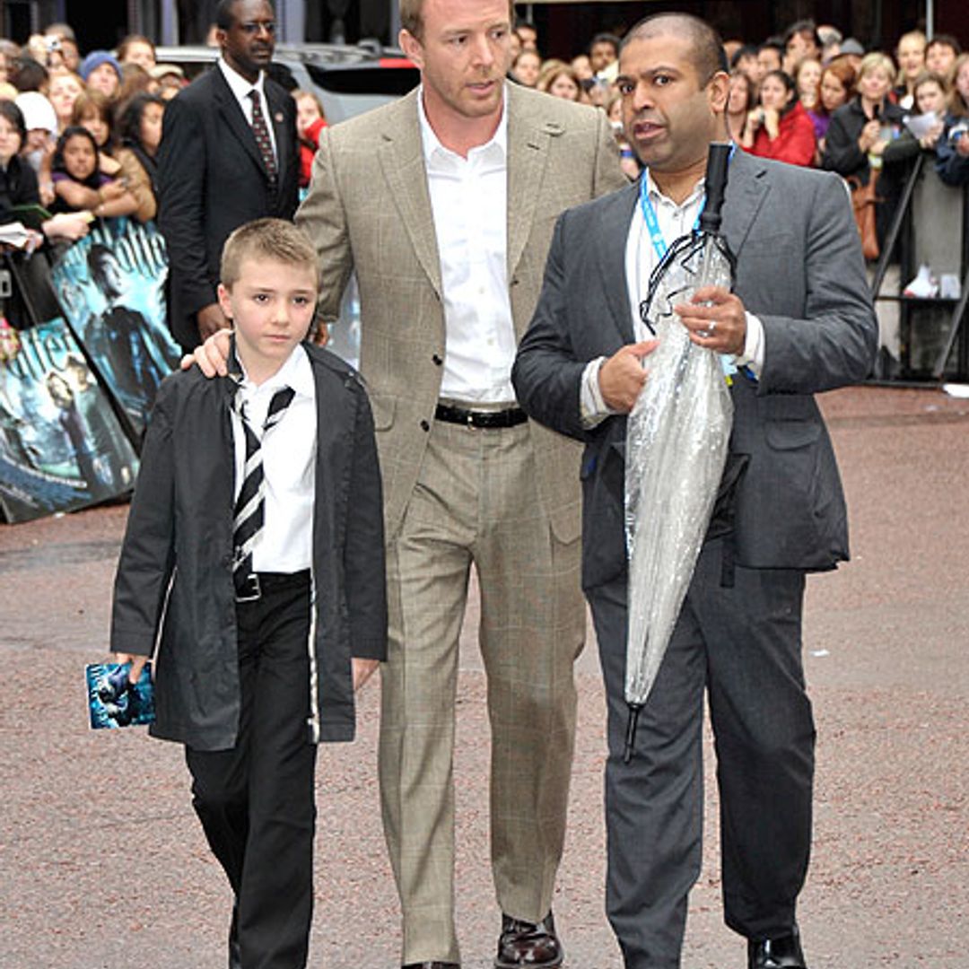 Hoping for a dry spell: Daniel Radcliffe and 'Harry Potter' stars drenched at premiere