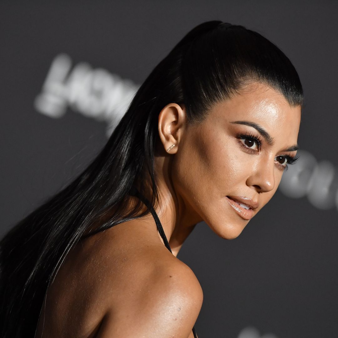 Kourtney Kardashian poses in risqué mini skirt and growing bump that sparks mixed reaction from fans