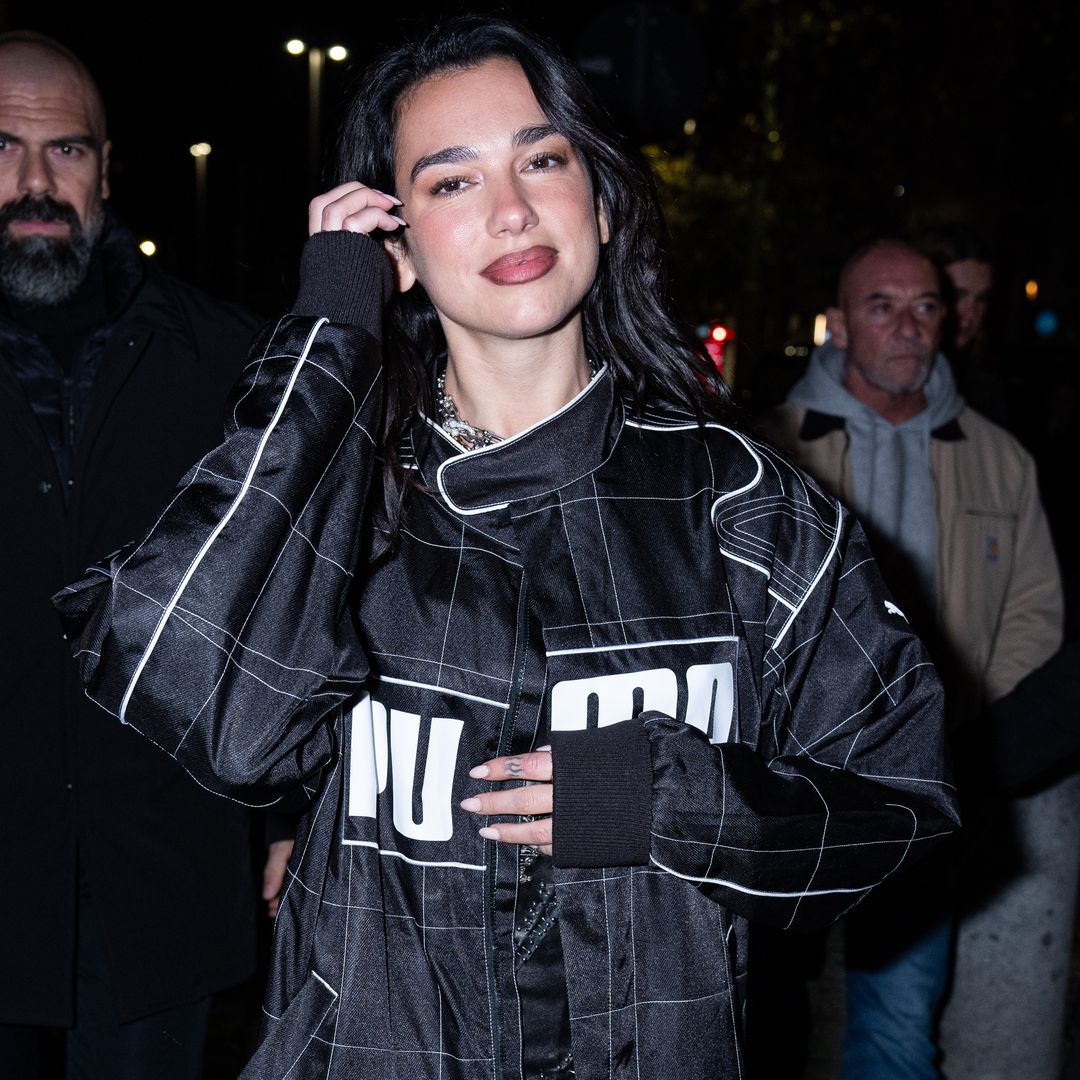 Dua Lipa says lingerie is always party-appropriate in lace suspenders