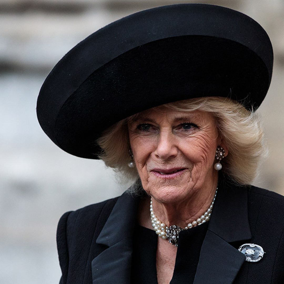 The Duchess of Cornwall looks perfect in purple Bruce Oldfield suit
