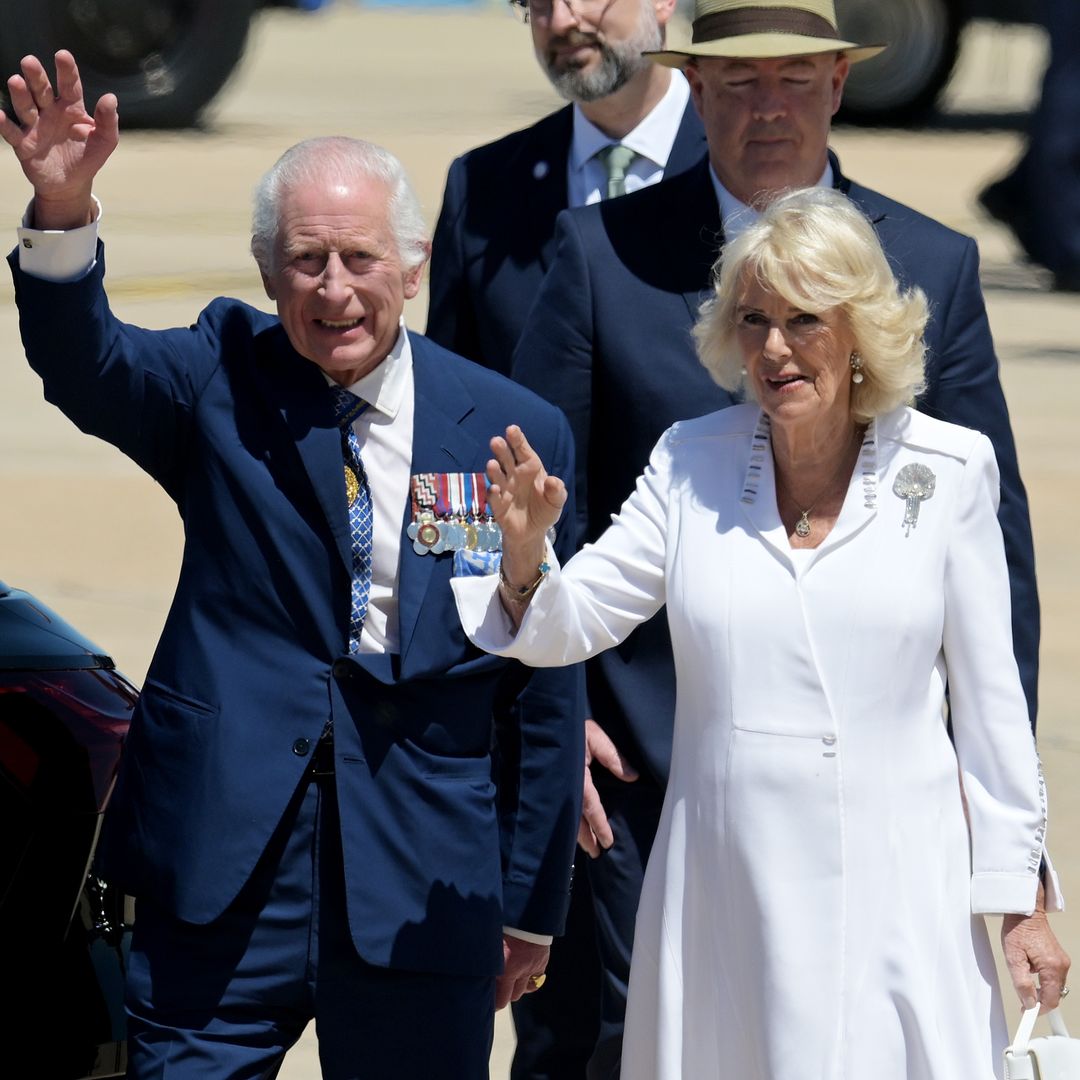 Queen Camilla stuns in elegant white silk dress as she and King Charles receive warm welcome in Canberra